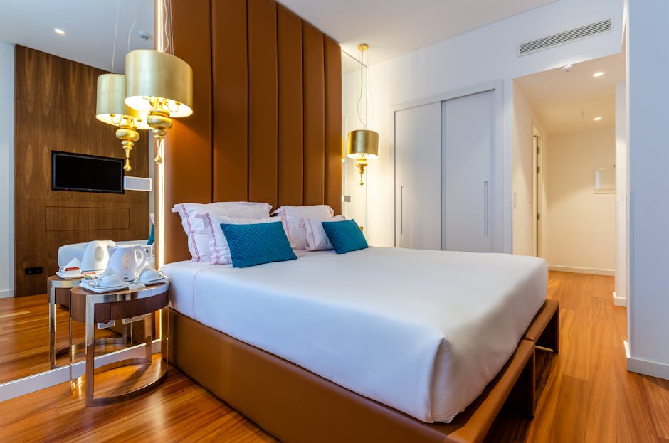 Elegant Brussels city centre hotel room with plush bedding and warm lighting