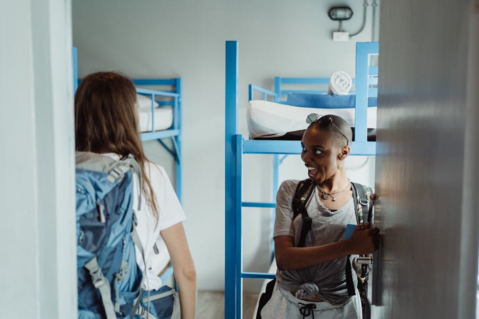 Bright modern hostel dormitory in Brussels with bunk beds and storage lockers