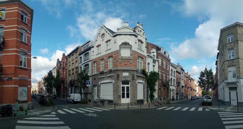 Brussels tram passing through historic neighborhood with charming European architecture