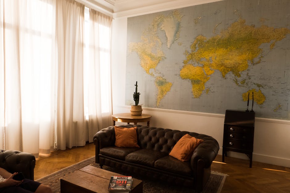 Brussels Airbnb apartments — elegant living room interior with world map decor
