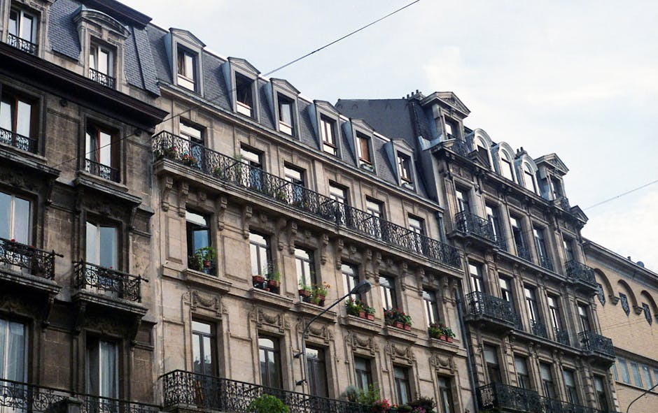 Brussels Airbnb apartments — classic facade with iron balconies in residential street
