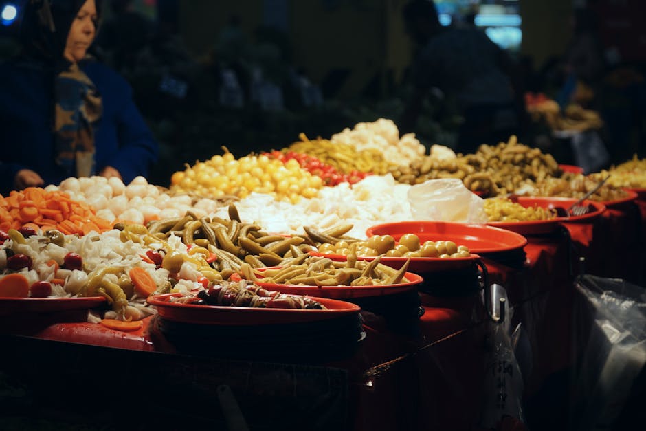 Brussels food markets — colourful pickle and olive display at indoor market stall