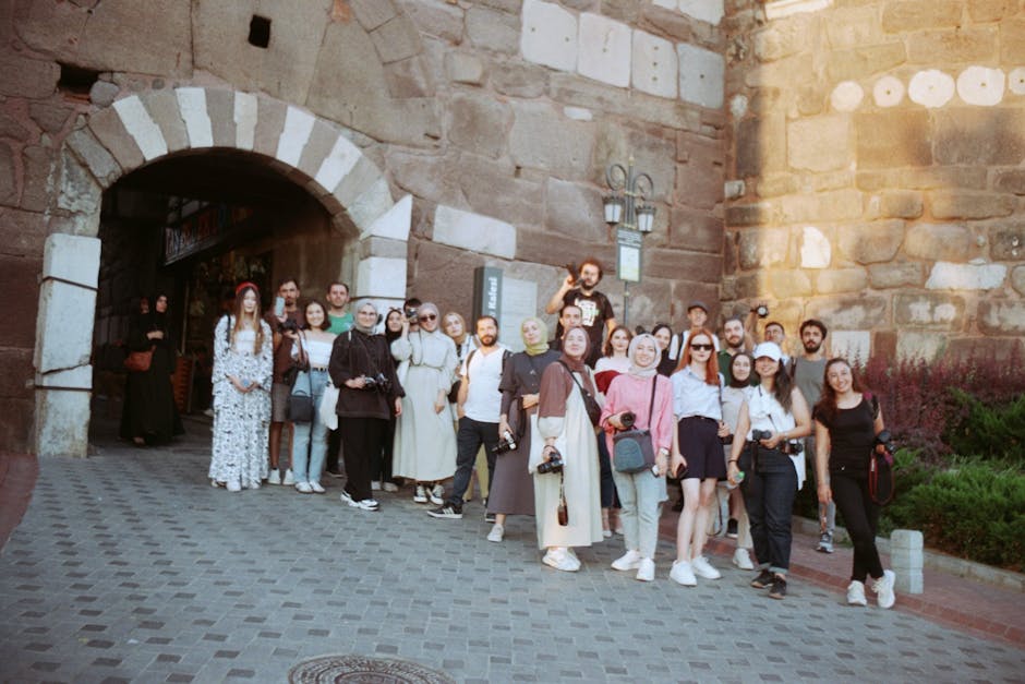 Brussels food tours — guided tour group at historic Brussels stone gateway