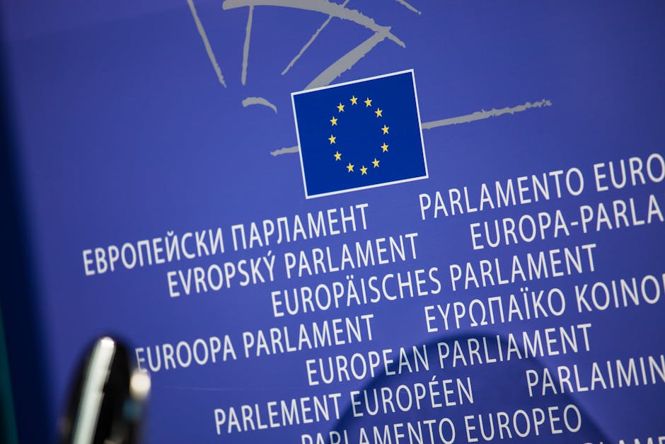 European Quarter Brussels guide — best close-up of EU flag with multilingual text outside European Parliament
