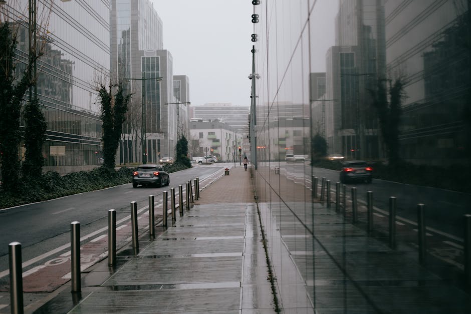 Avenue Louise Brussels guide — best modern car driving on narrow road near contemporary multistory buildings