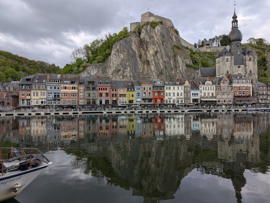 Dinant day trip from Brussels — best scenic view of Dinant Belgium featuring colorful houses and Citadel reflection