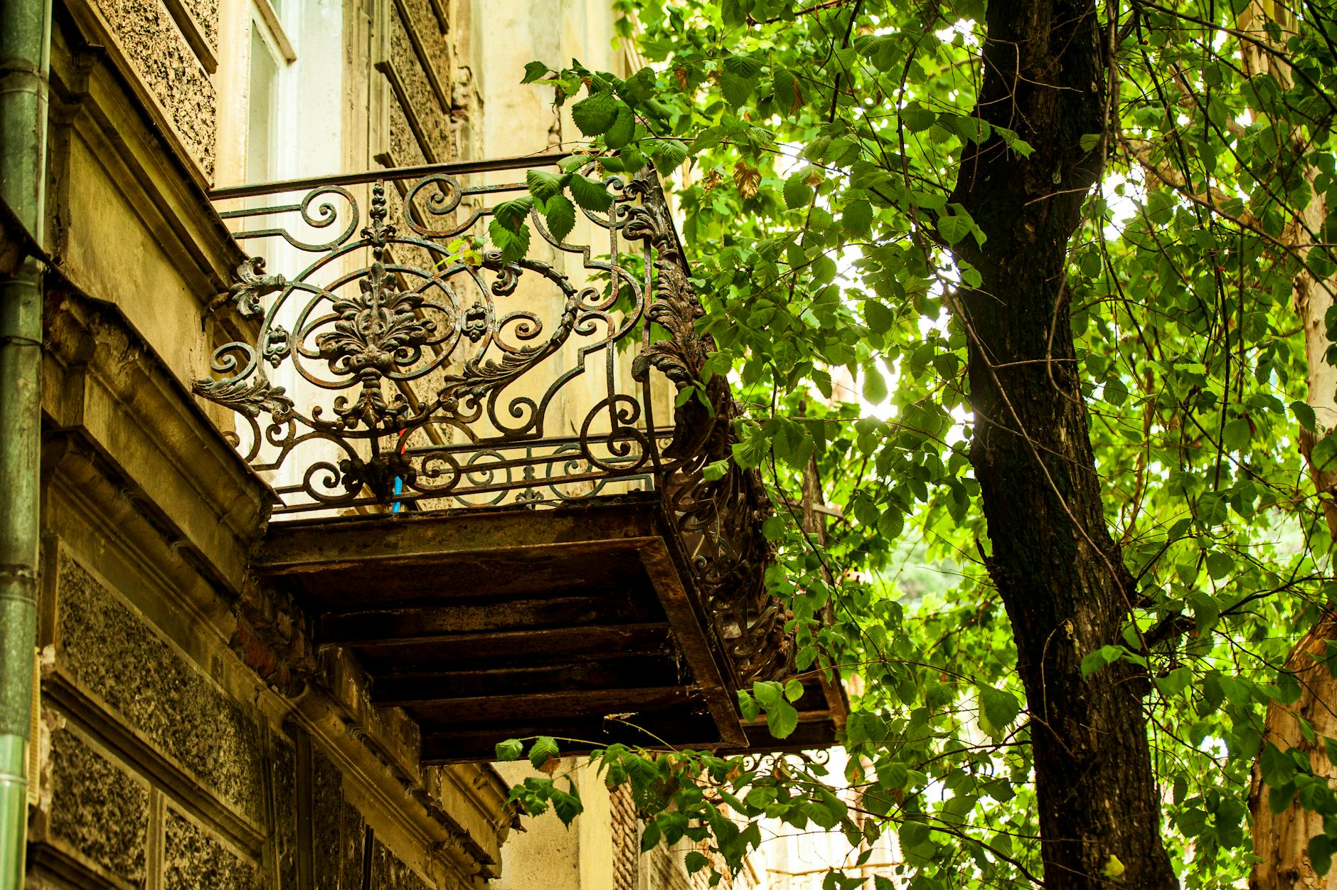 An ornate Art Nouveau building facade with decorative ironwork in Brussels
