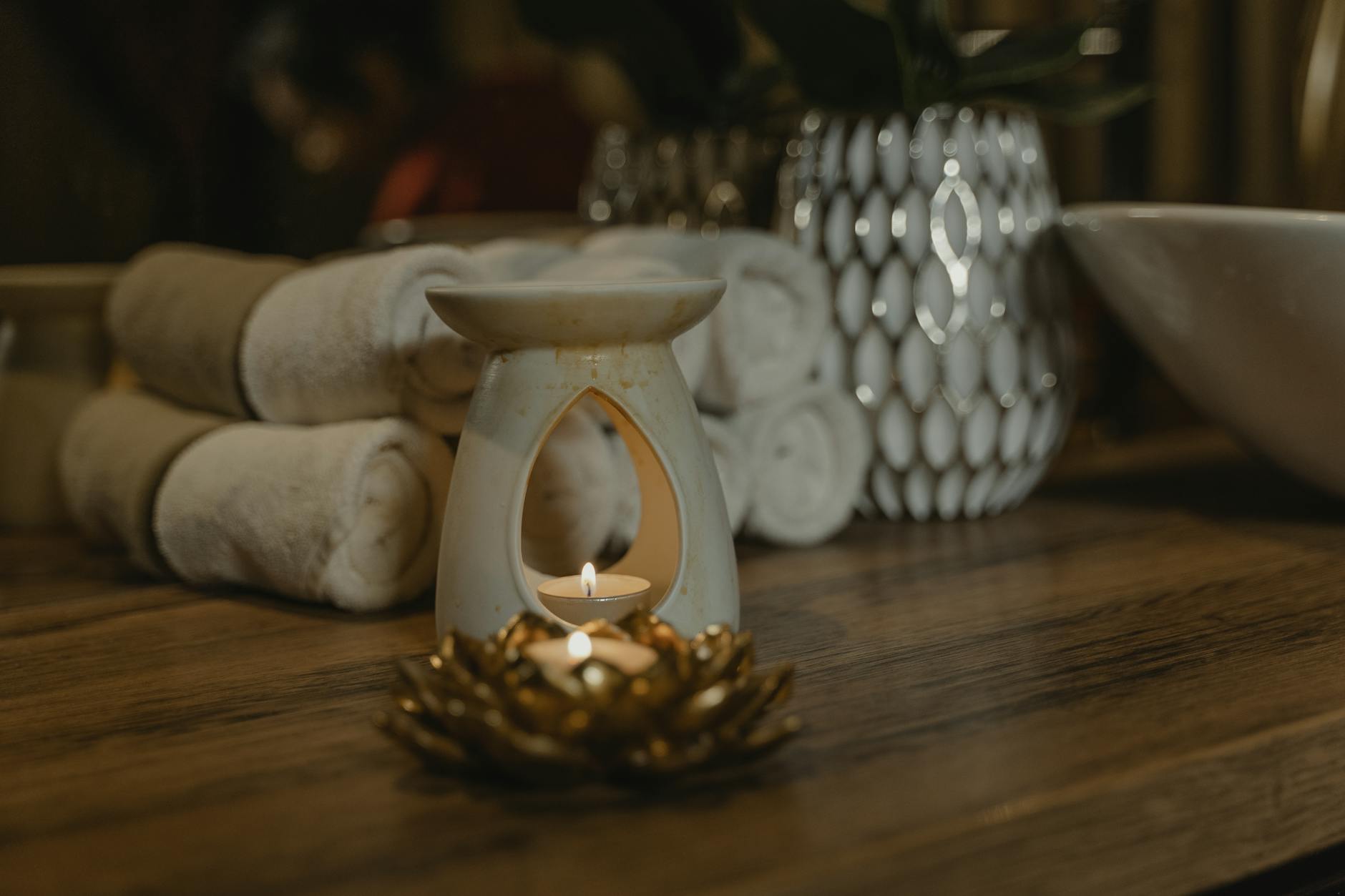 A warm and atmospheric spa setting with candles and relaxation