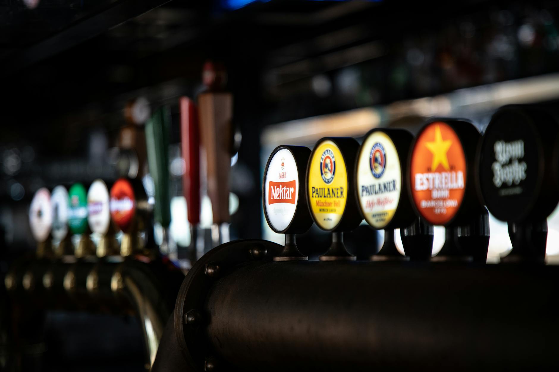 Craft beer bar with multiple beer taps and Belgian beer selection