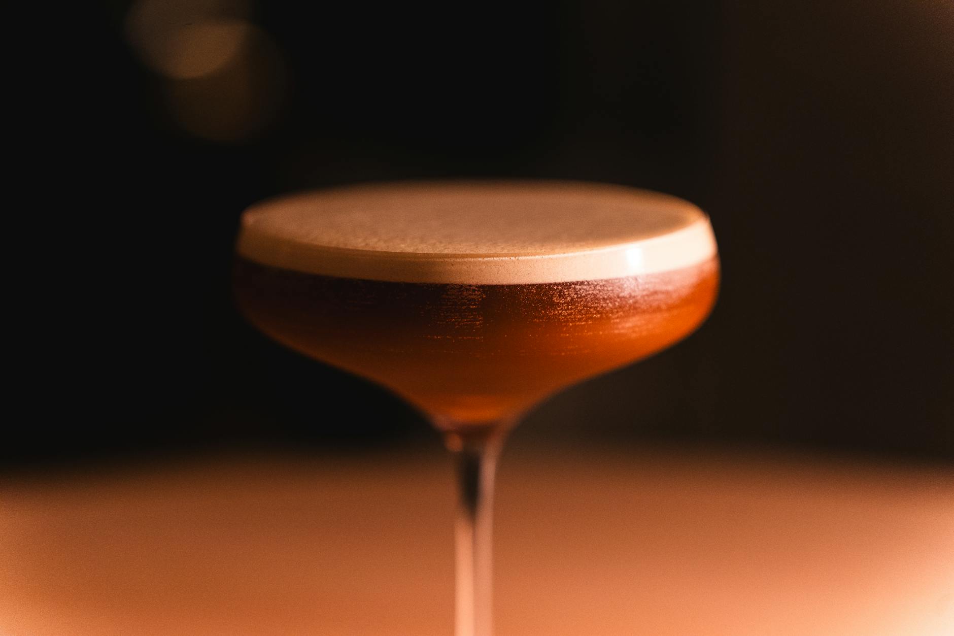 Sophisticated cocktails served in an atmospheric evening bar setting