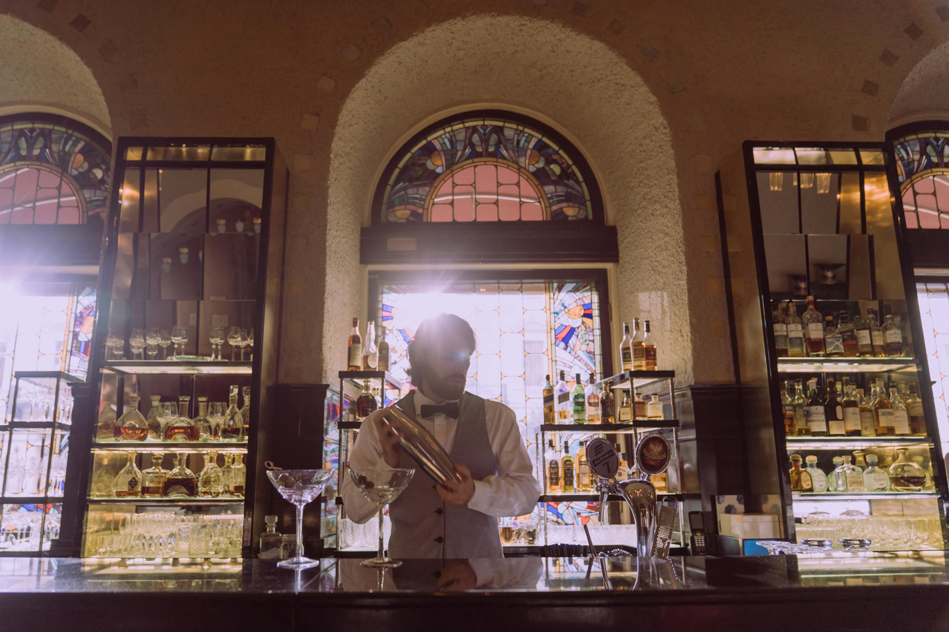 Elegant art deco cocktail bar interior with ambient lighting