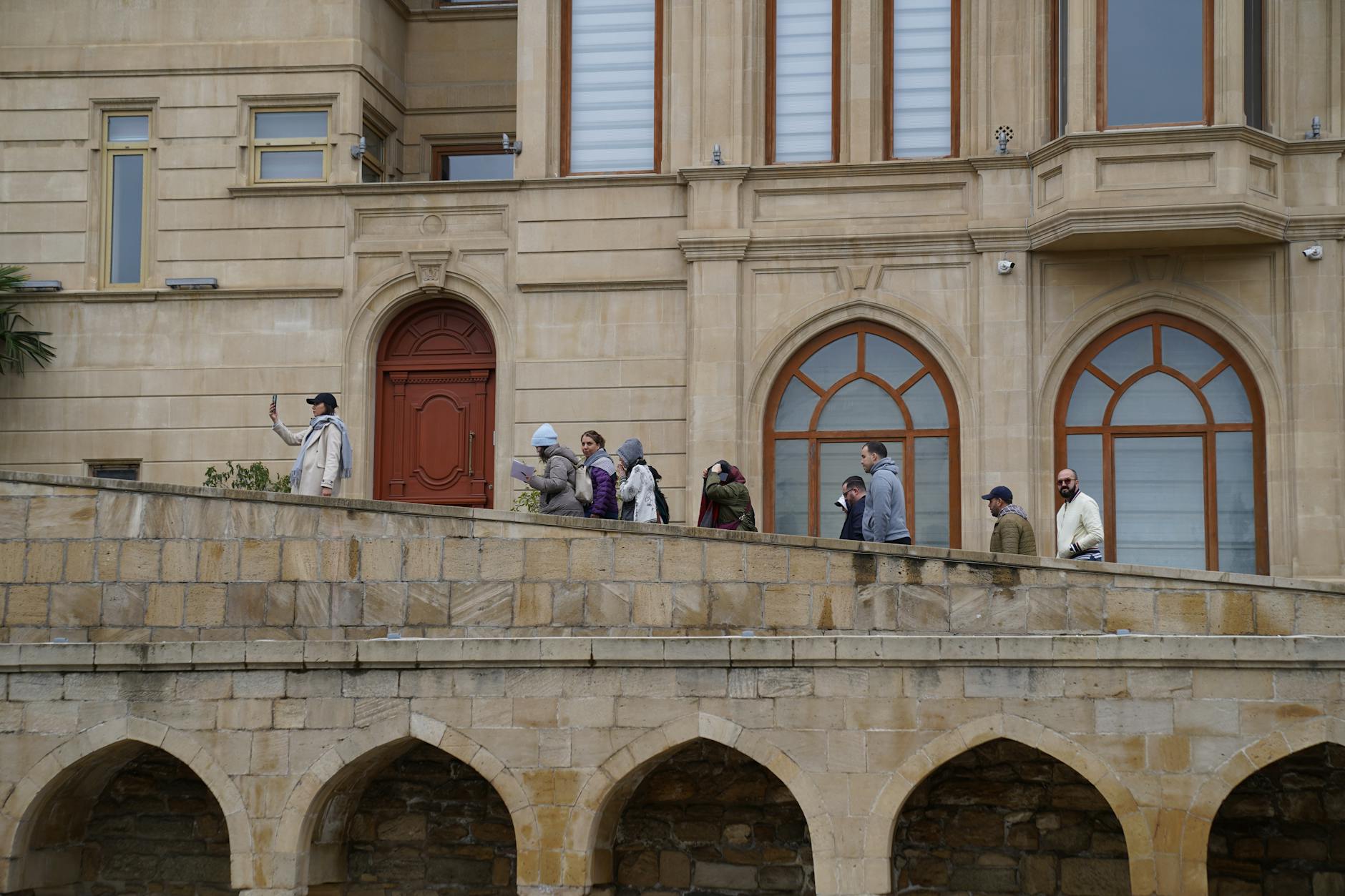A group of tourists on a guided walking tour through a historic city centre