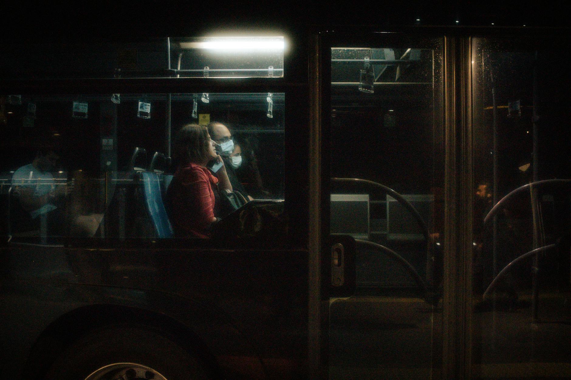 City public transport at night with well-lit streets