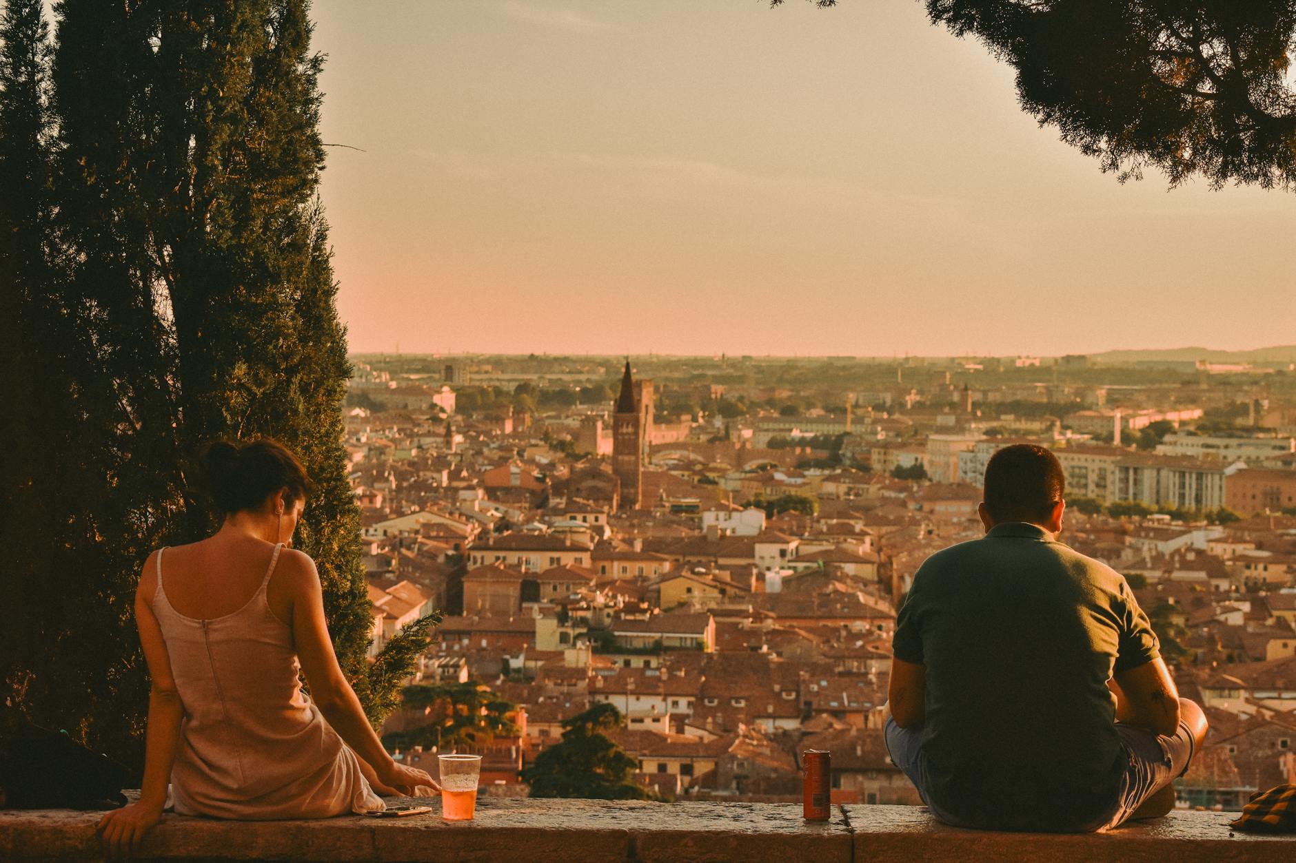 A romantic golden sunset over a European city skyline