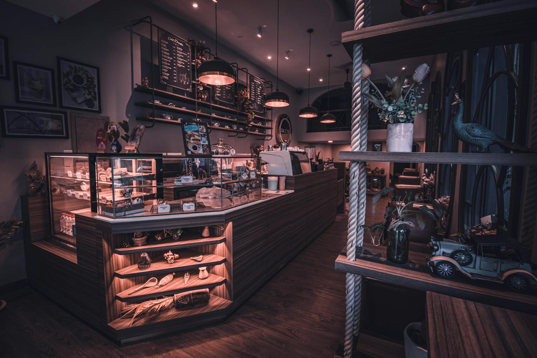 A cozy café interior with warm lighting coffee and pastries