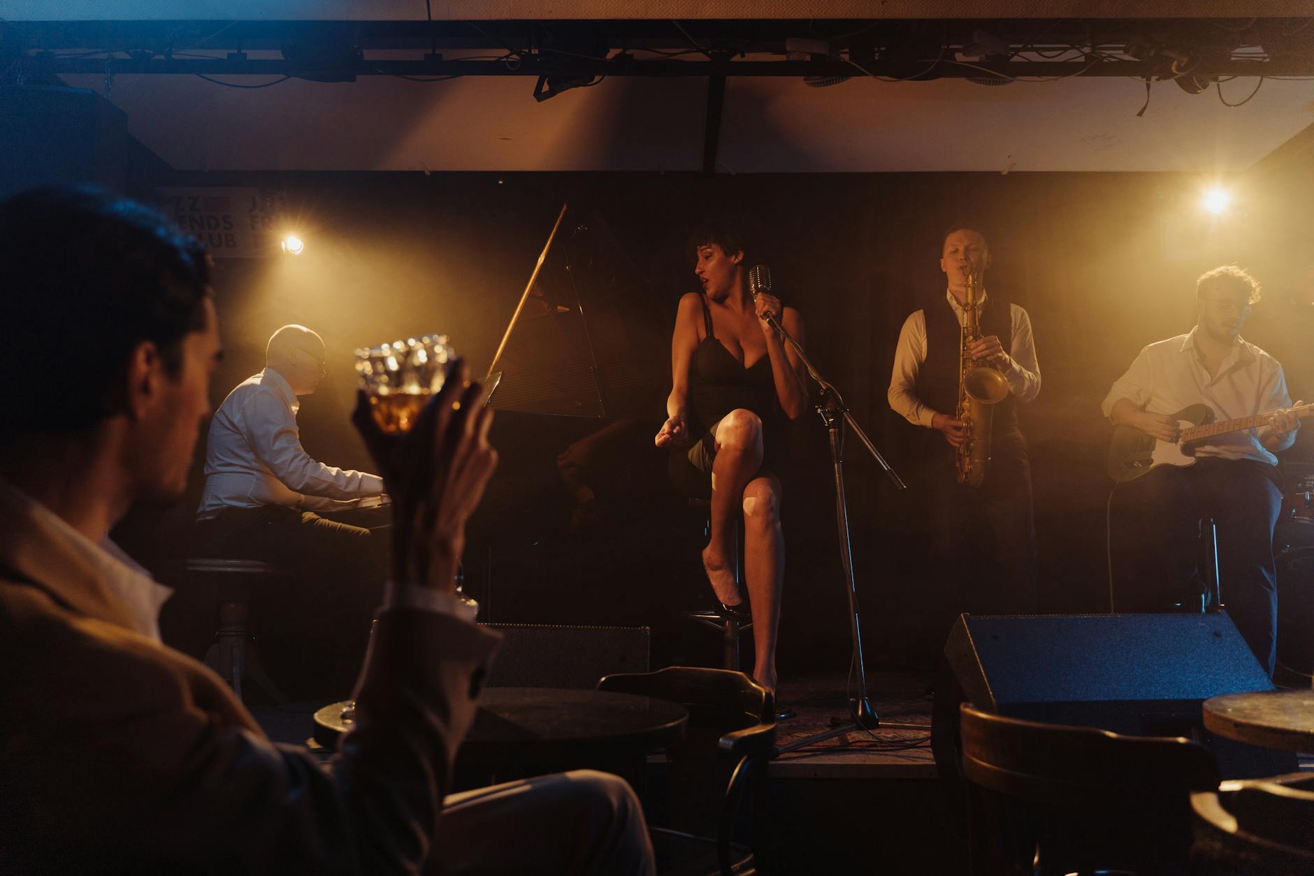 An intimate jazz bar with live performance and warm lighting
