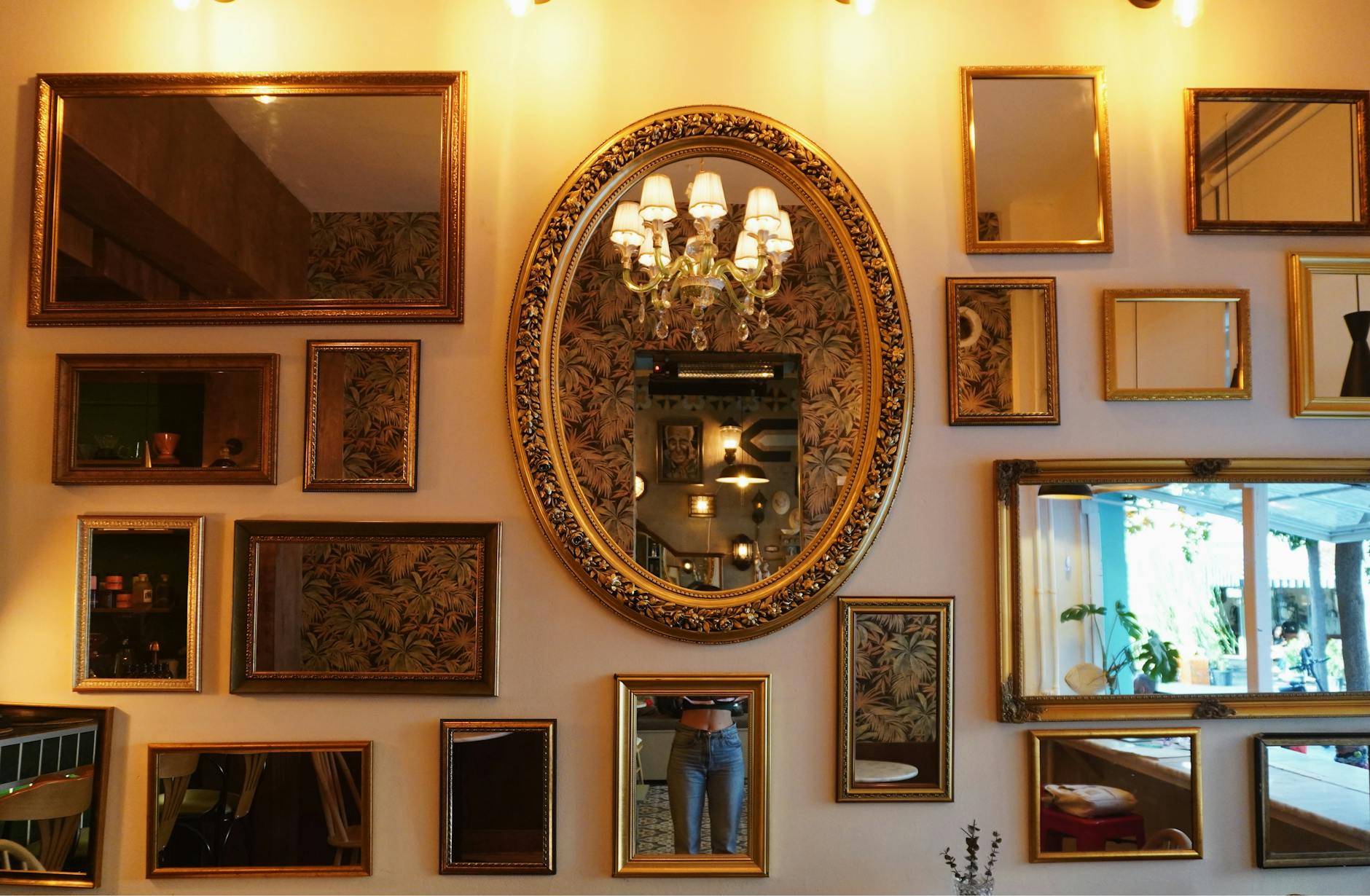 Ornate interior of a historic Belle Époque café with mirrors and wood panelling