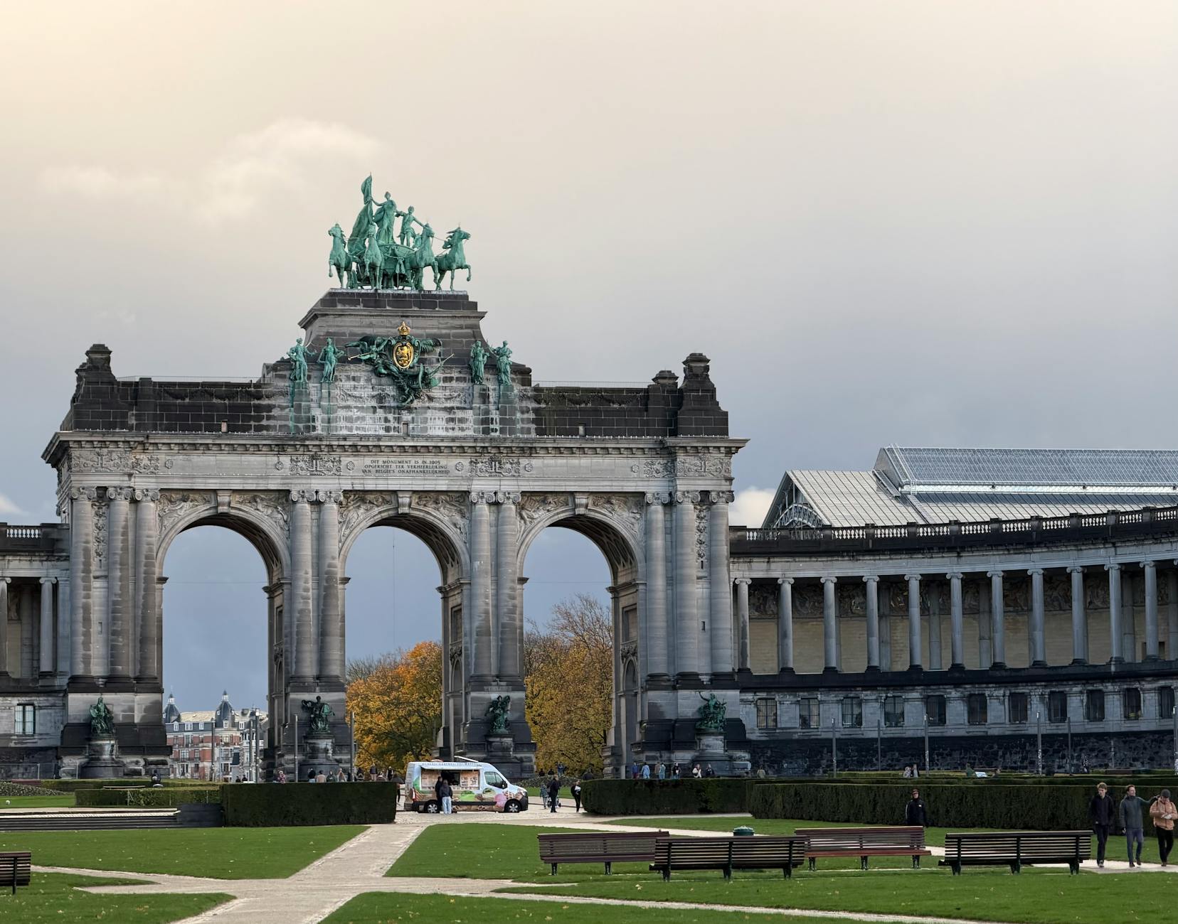 The triumphal arch at Parc du Cinquantenaire in Brussels with green lawns