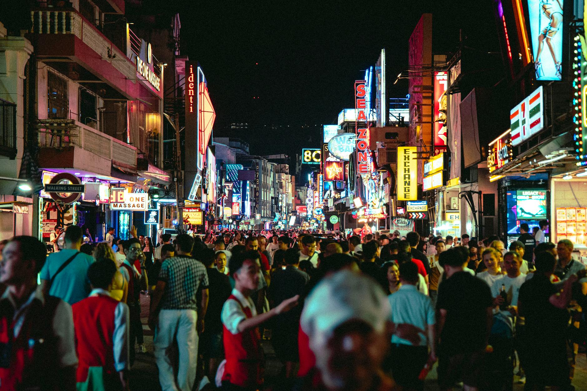 A vibrant nightlife district with bar terraces filled with evening crowds