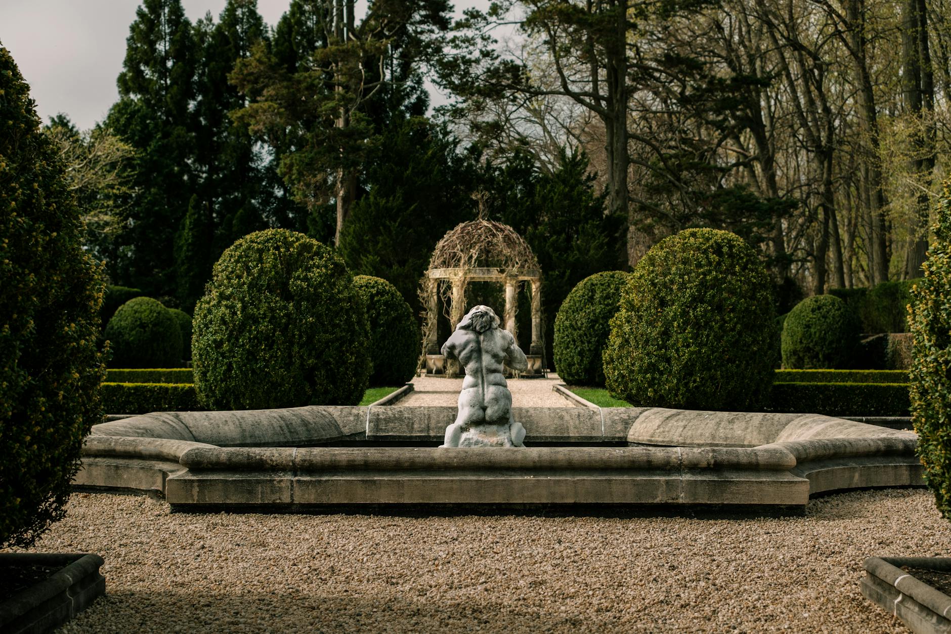 A romantic formal garden with sculpted hedges and flowers