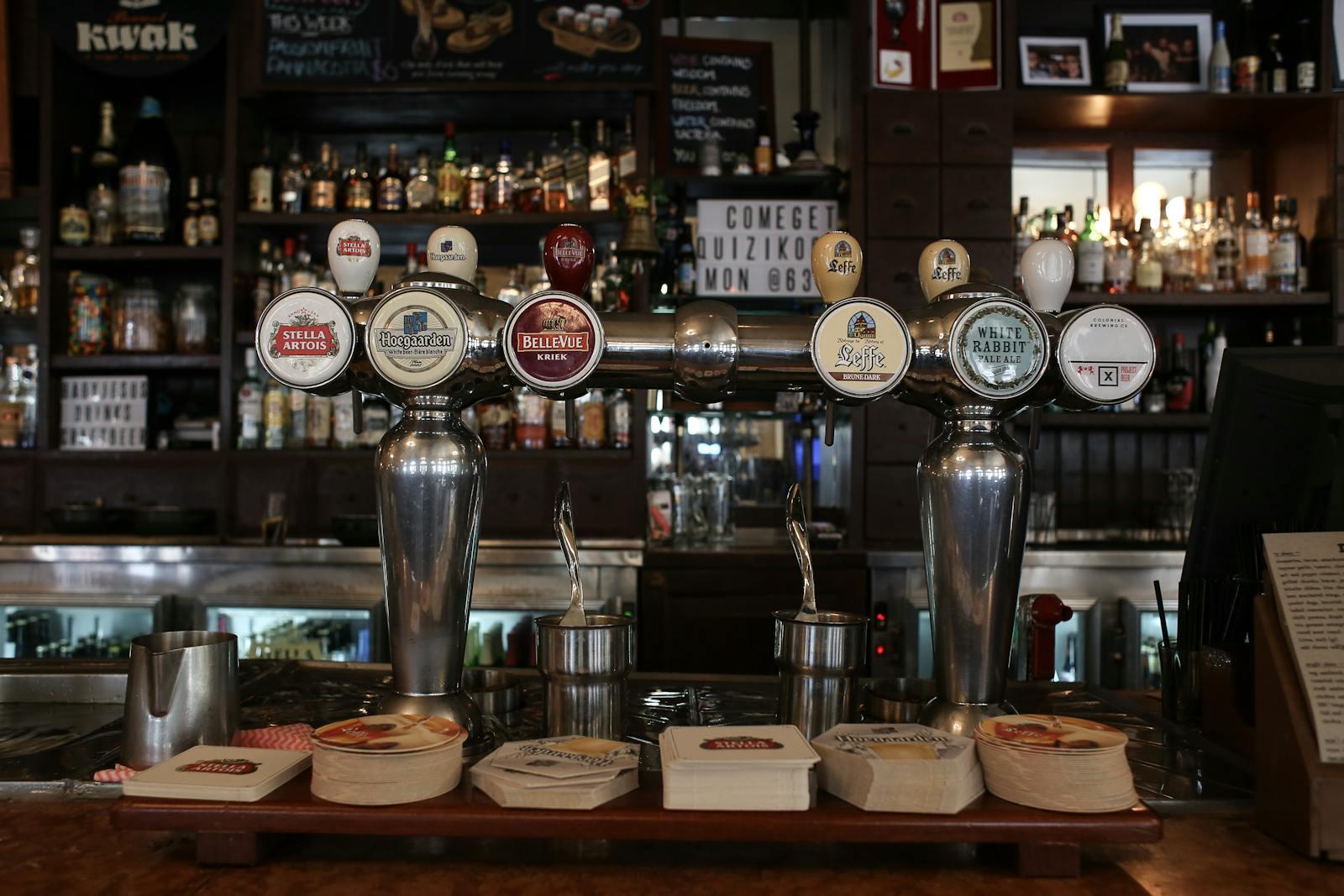 Best bars in Brussels — taps showcasing Belgian beer brands in stylish pub interior