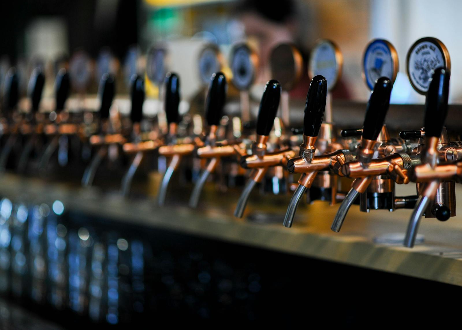 Craft beer bars Brussels — modern industrial craft brewery interior with brewing tanks and tasting bar in Brussels