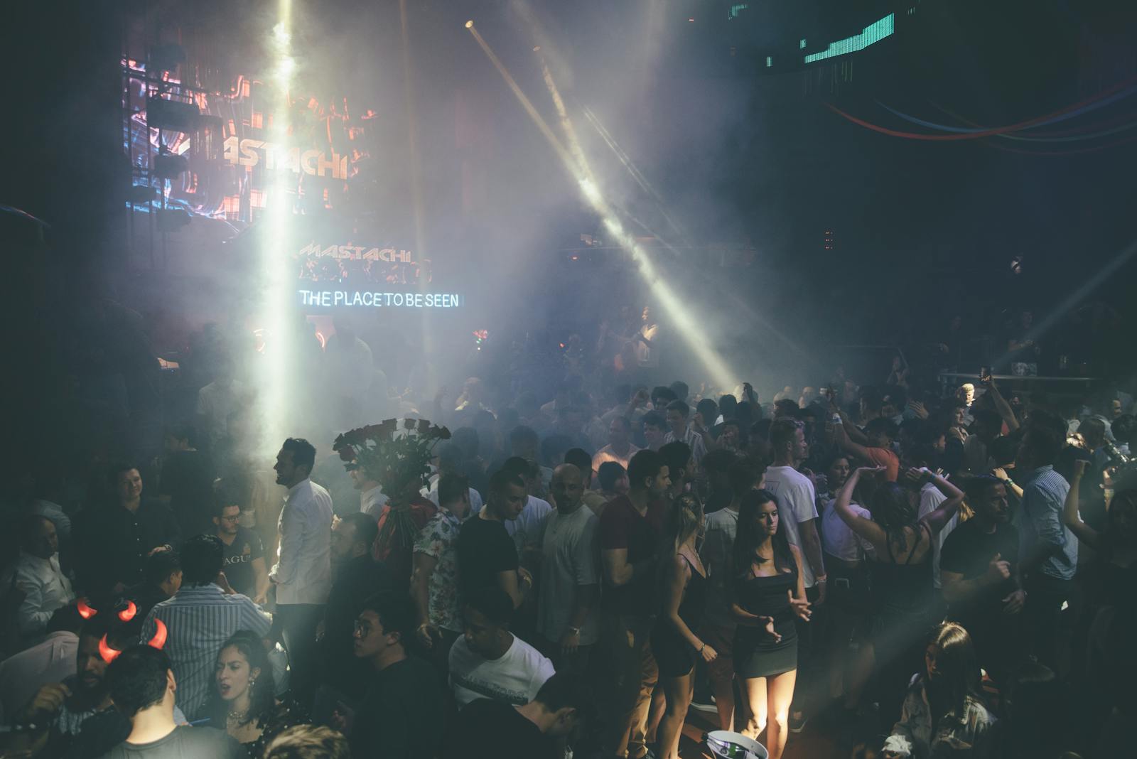 Brussels clubs electronic music — exciting nightclub scene with dancing crowd vibrant lights and music atmosphere