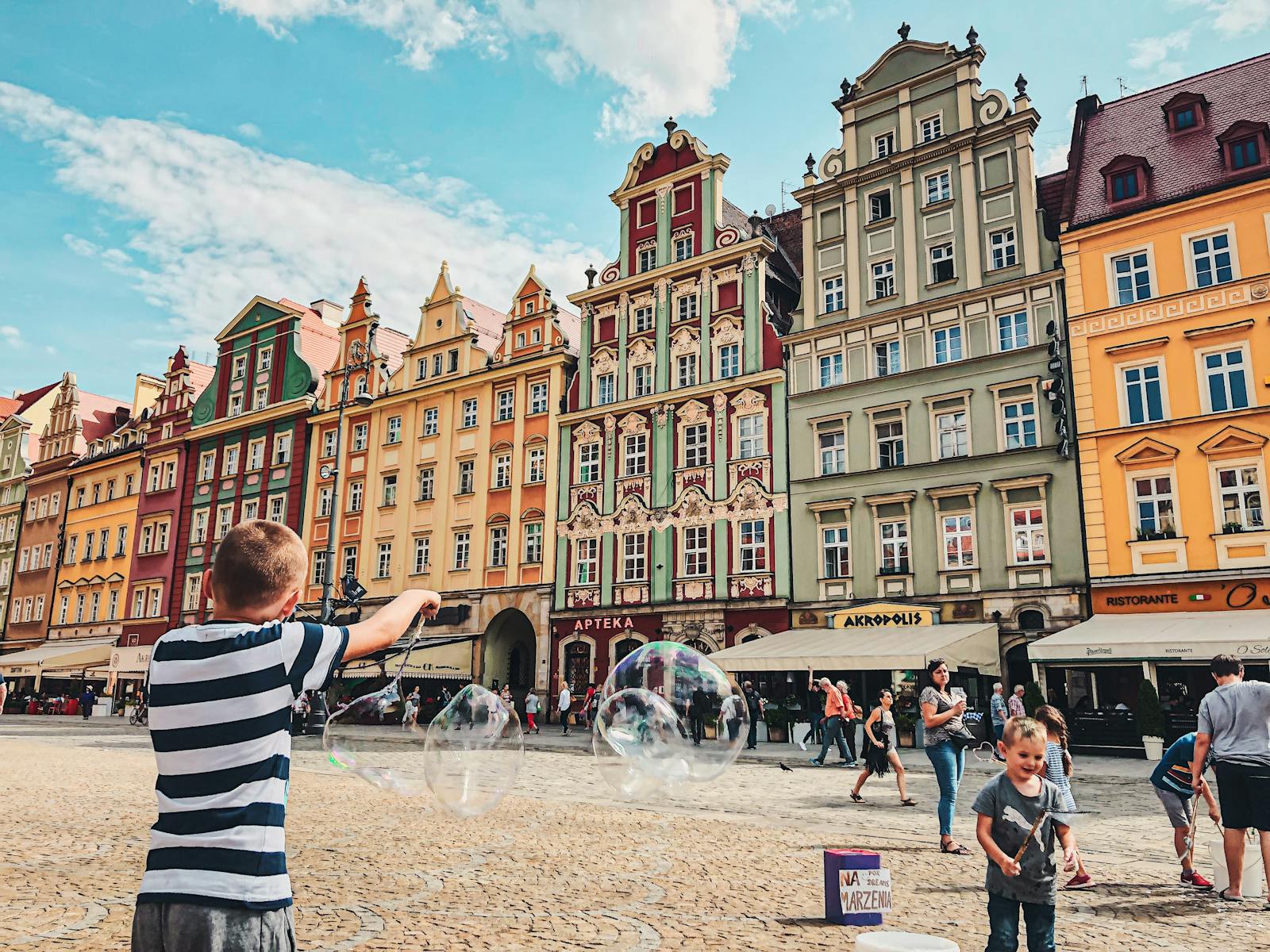 Brussels with toddler baby — best family with stroller and toddler exploring Brussels Cathedral square European city