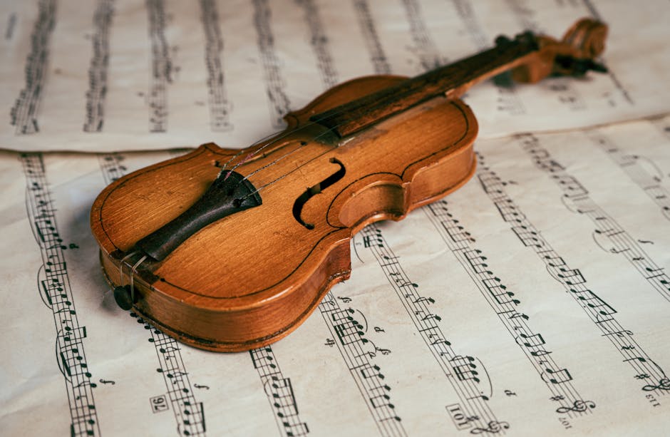 Musical Instruments Museum Brussels — best vintage violin resting on sheet music highlighting beauty of instrument