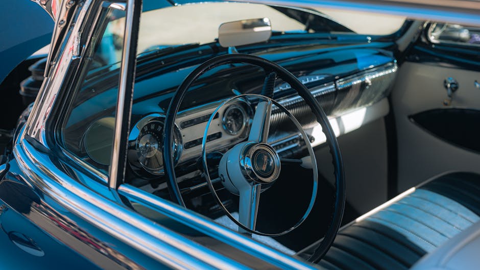 Autoworld Brussels — best close-up of classic Oldsmobile dashboard and steering wheel showcasing retro design