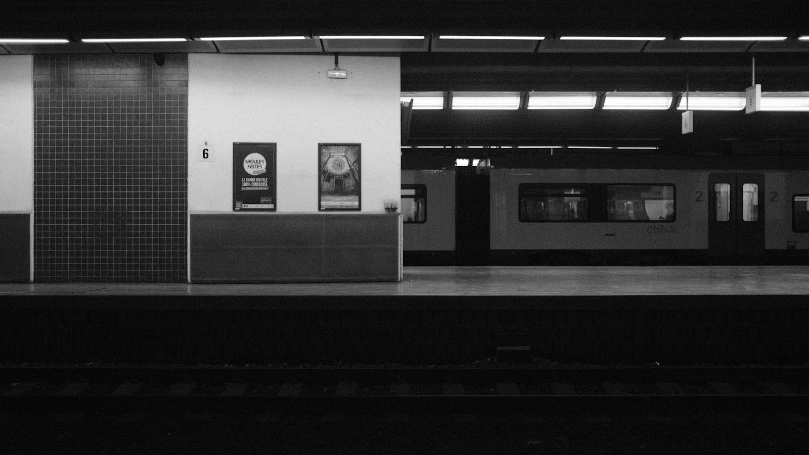 Languages spoken Brussels — best bilingual French Dutch metro station sign showing both languages used in Brussels