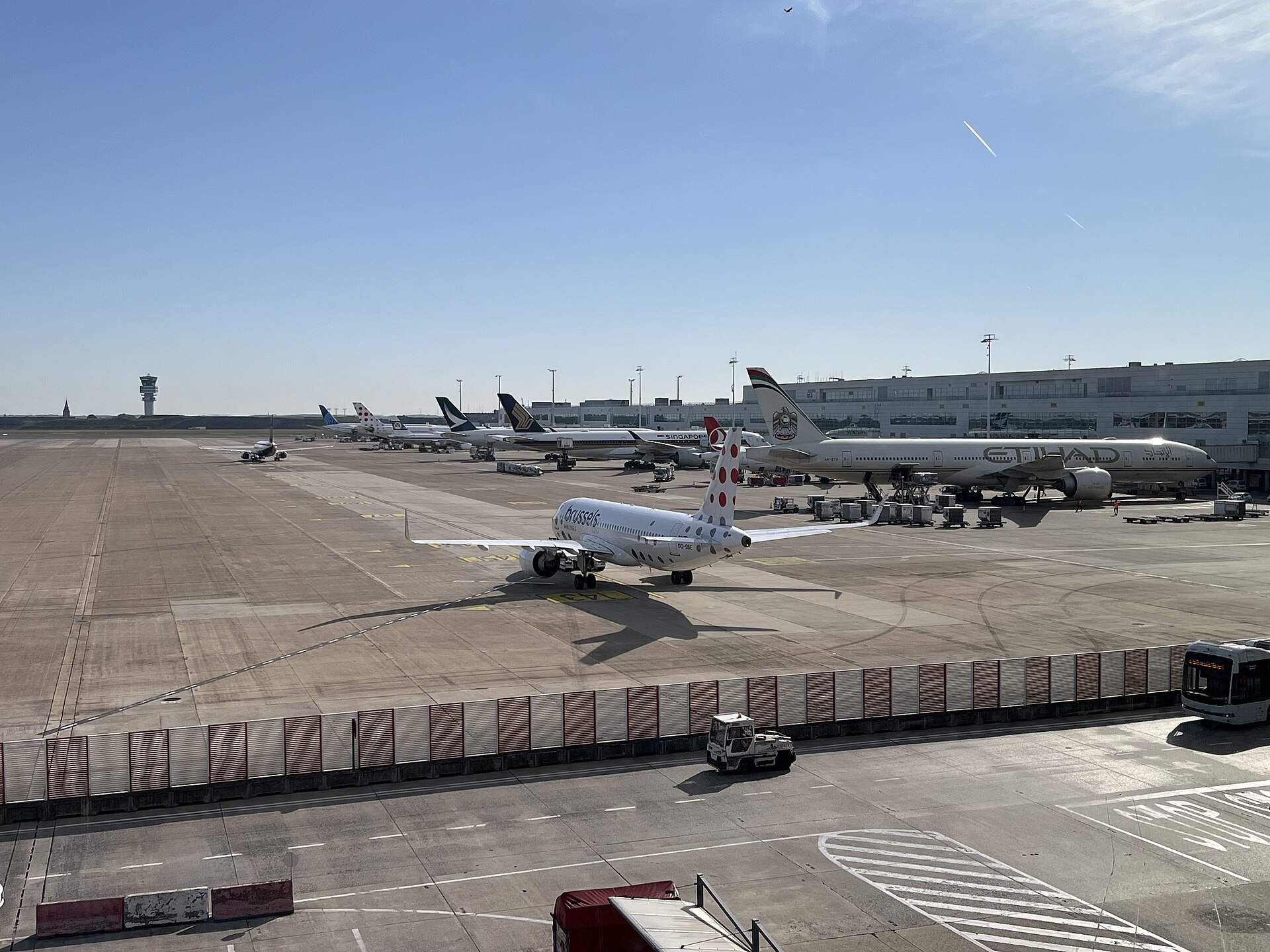 Aircraft parked at the terminal at Brussels Airport Zaventem under a clear sky