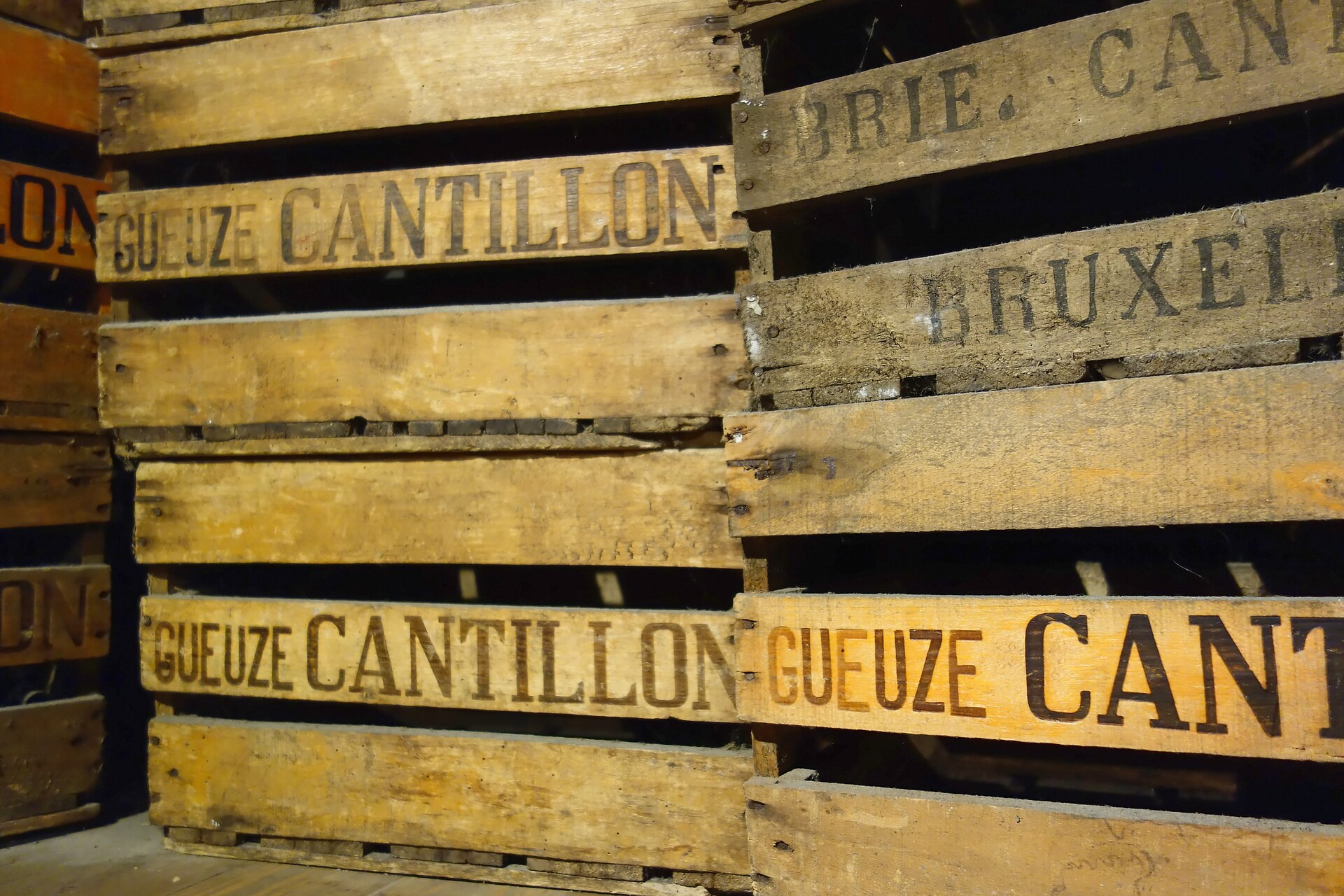 Stacked old wooden crates stencilled Gueuze Cantillon Brasserie Bruxelles