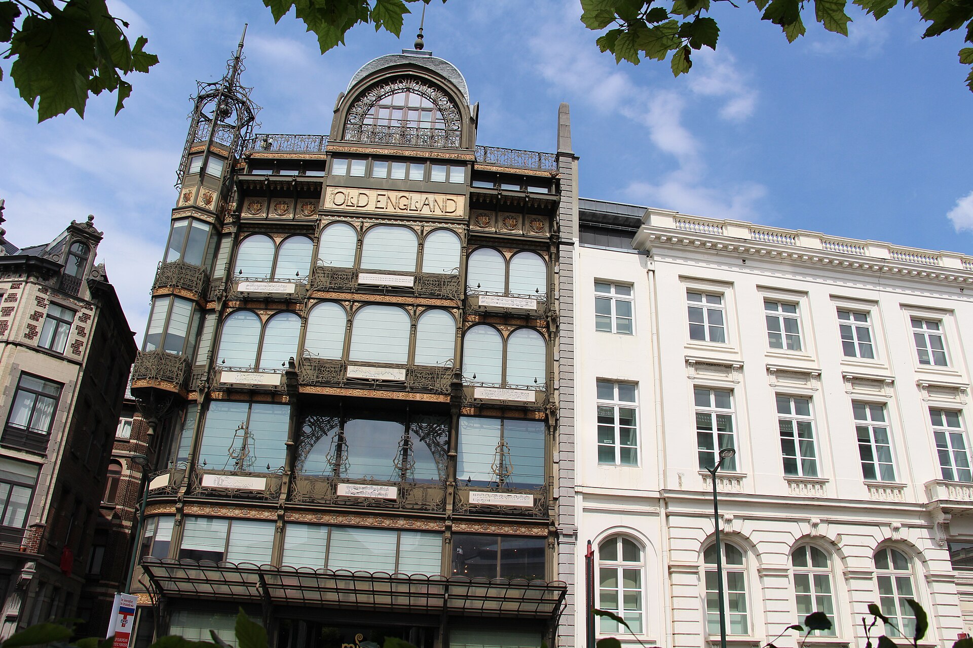 The Art Nouveau Old England building in Brussels, home of the Musical Instruments Museum, with black ironwork and glass facade