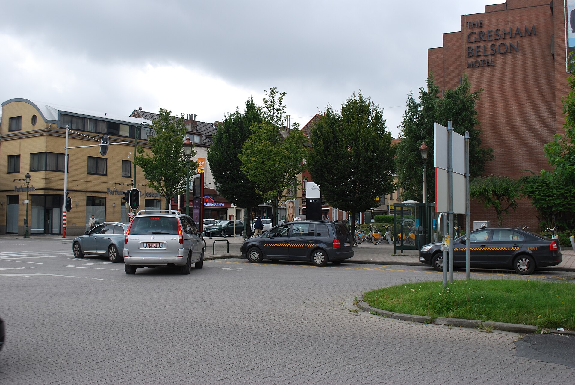 Black taxis with yellow checker stripes wait at the Paduwa rank beside the Gresham Belson Hotel in Evere, Brussels.