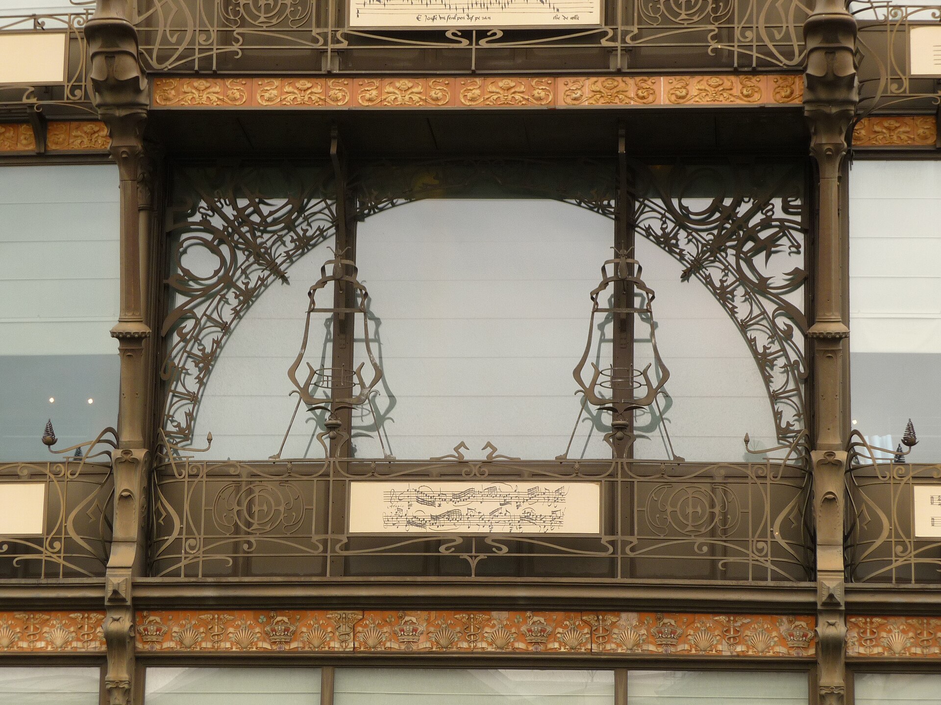 Decorative iron window supports and musical notation panels cover the Old England building in Brussels, home to the Musical Instruments Museum.
