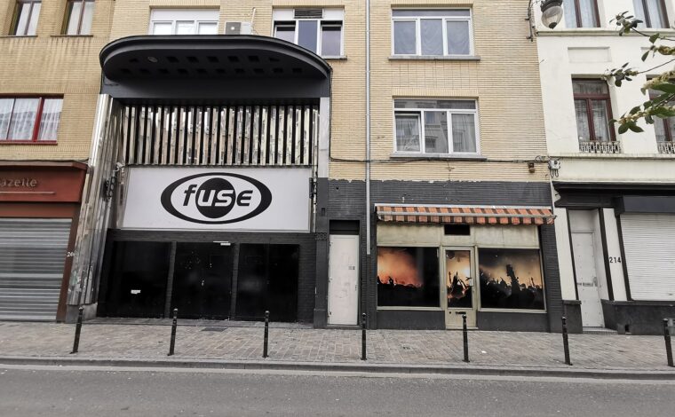 The signed entrance of Fuse nightclub on Rue Blaes in Brussels, with brick facades and a cobbled pavement.